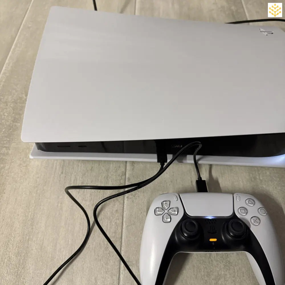 White PlayStation 5 gaming console with DualSense controller.