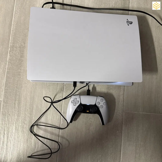 White PlayStation 5 console with a DualSense controller.