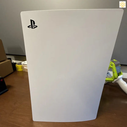 White PlayStation 5 gaming console with the PS logo.