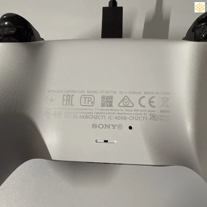 PlayStation 5 DualSense controller showing its regulatory information label.