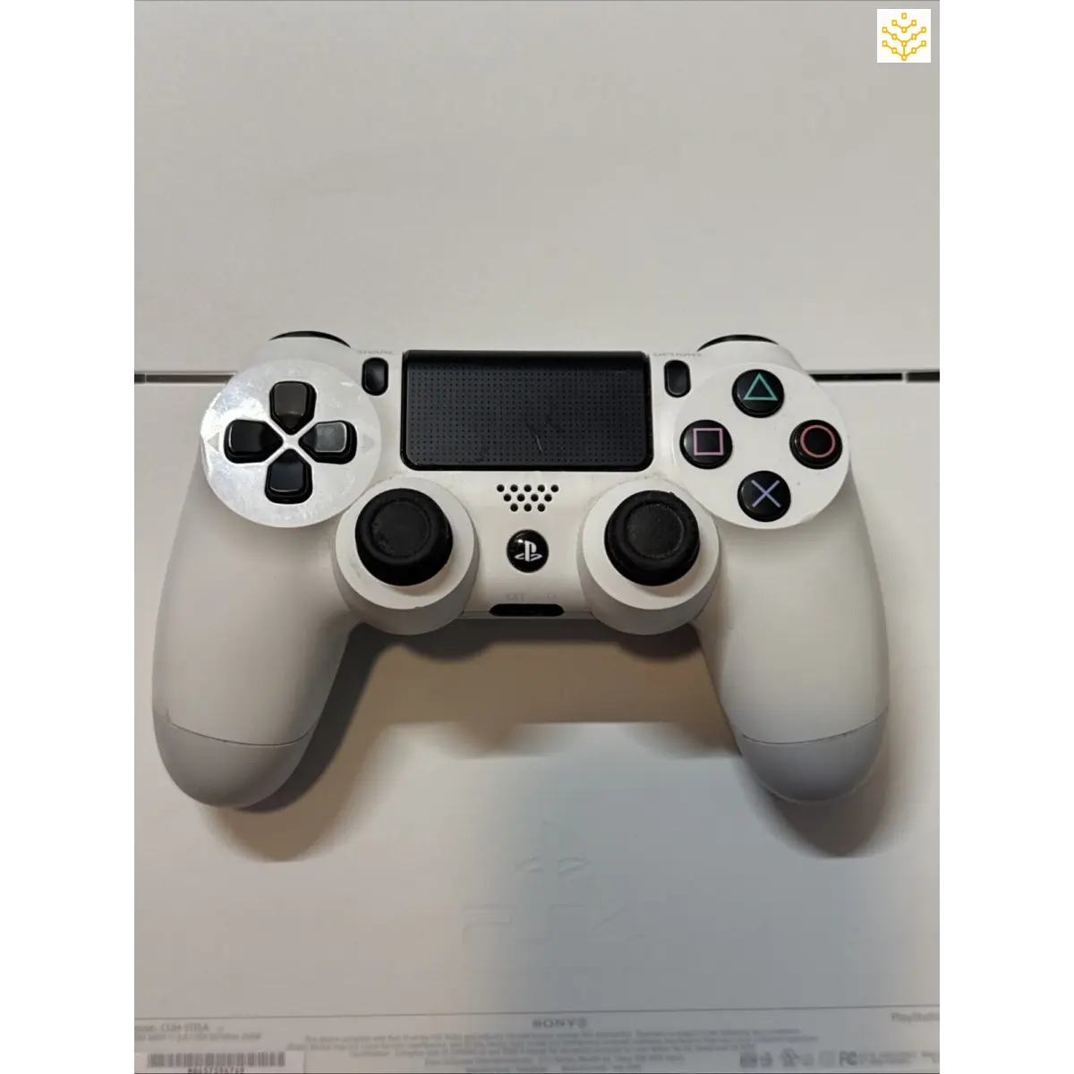 White PlayStation 4 DualShock controller.