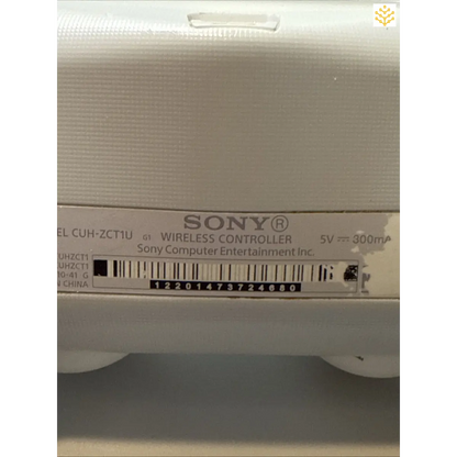 Sony wireless controller with product information label visible.