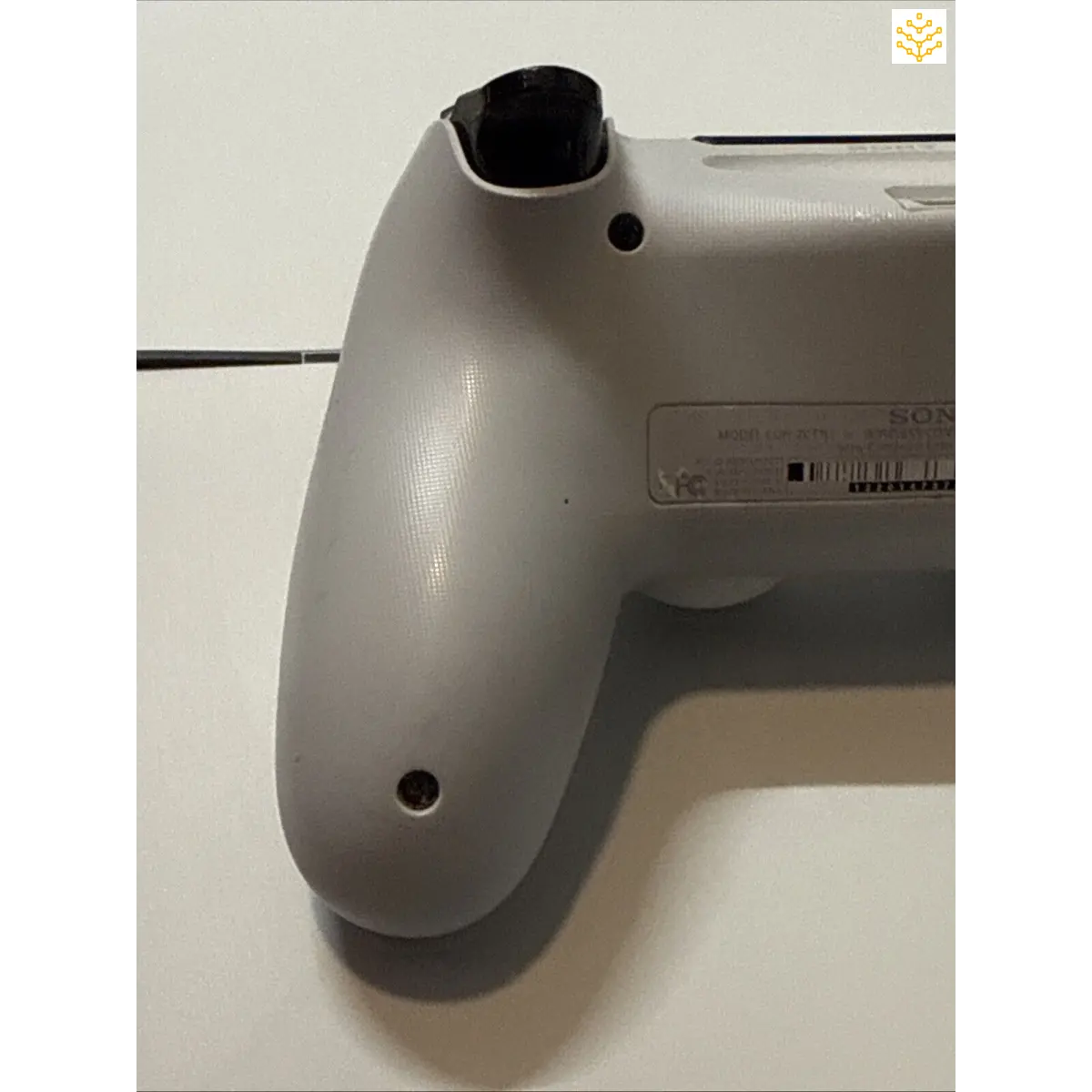 Video game controller handle or grip, likely from a PlayStation console.