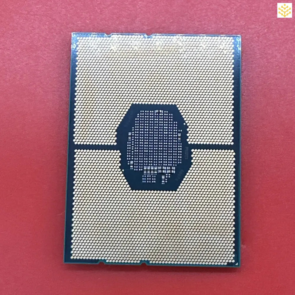 Computer processor chip with visible contact pads and central processing area.