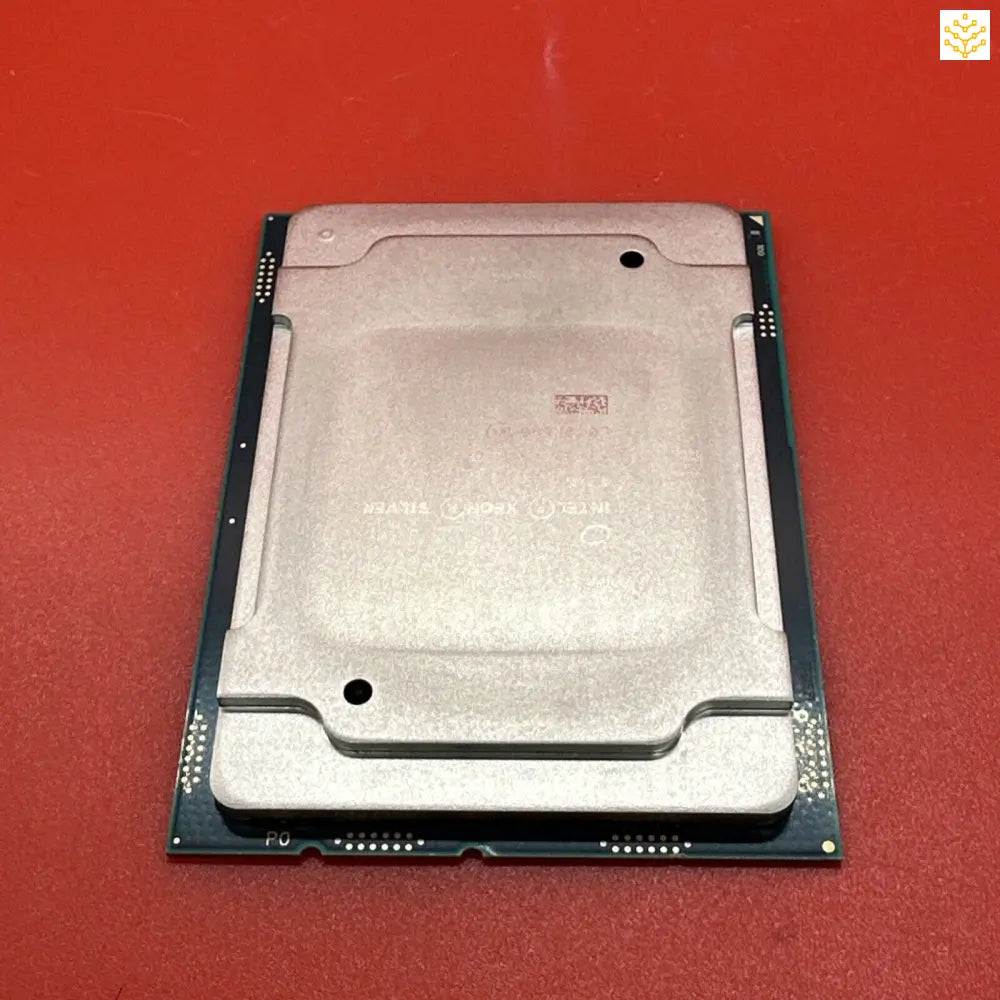 Computer processor chip with a metallic silver casing.