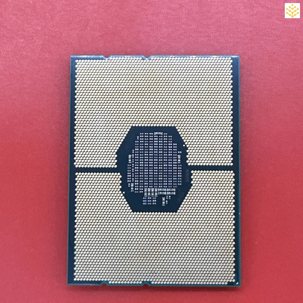 Computer processor chip with a grid pattern of metallic contacts.