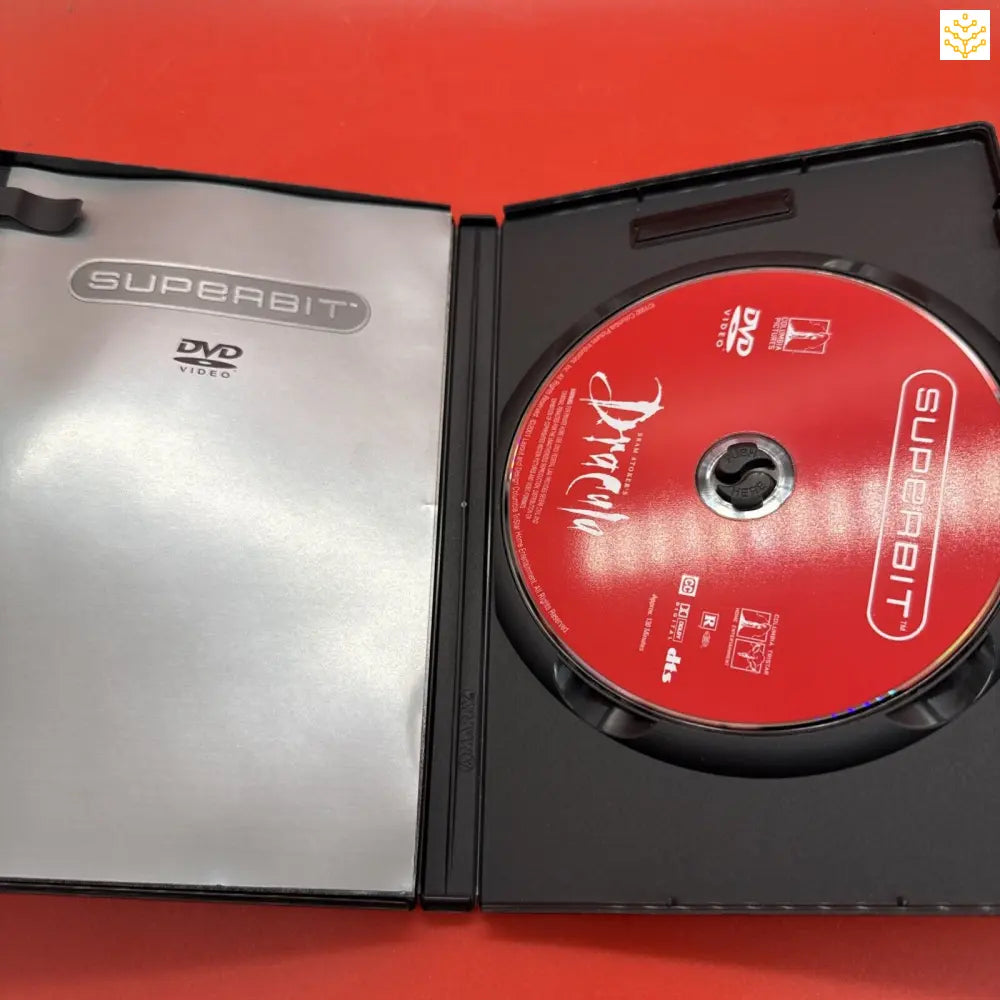 Open DVD case showing a red disc and SuperBit branding.