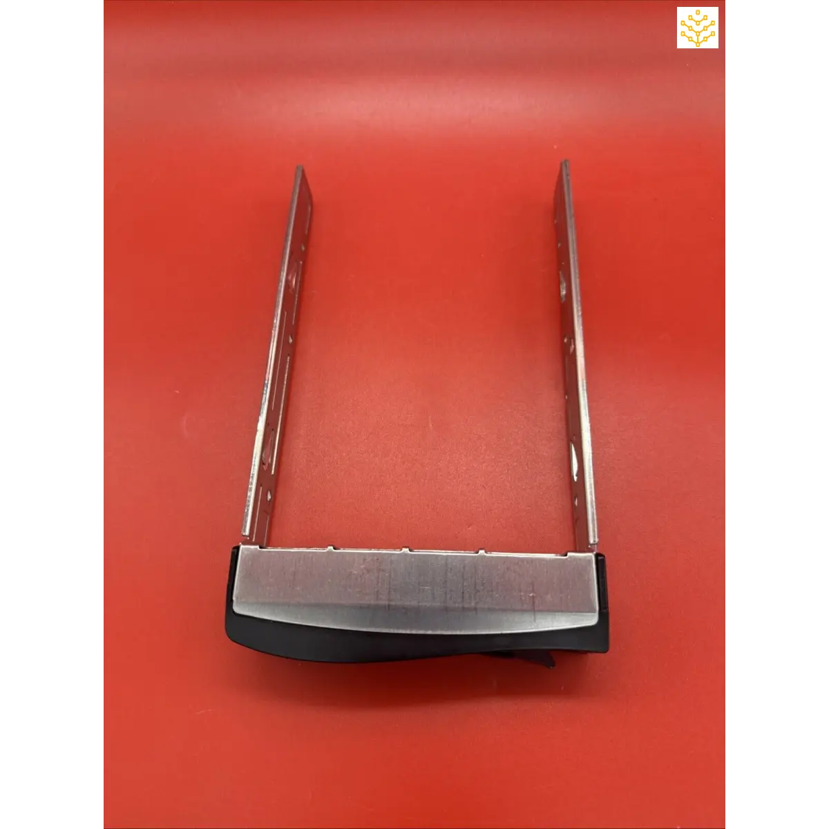 Wireless router with two antennas on a red surface.