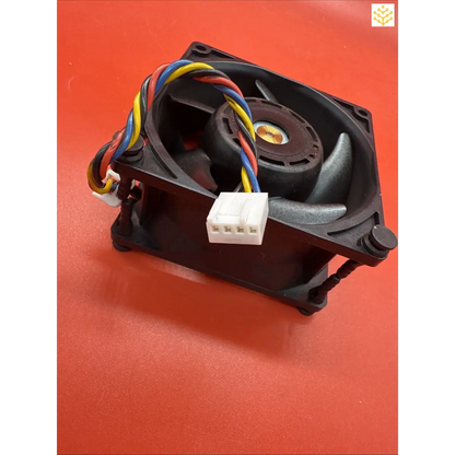 Computer cooling fan with colorful wires attached to a white connector.