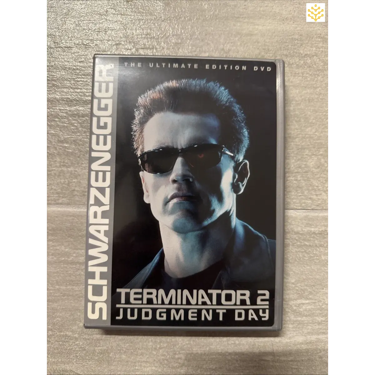 DVD case for ’Terminator 2: Judgment Day’ featuring a close-up of the Terminator character wearing sunglasses.