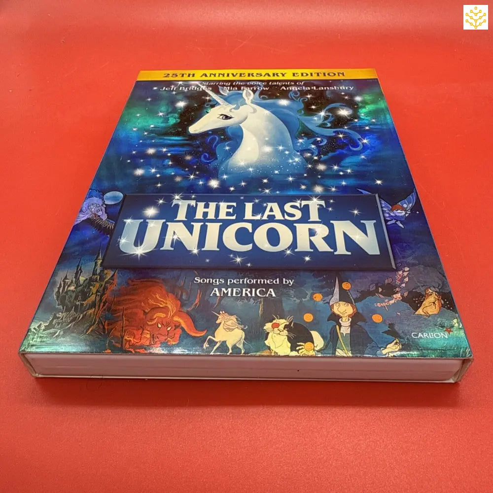 25th Anniversary Edition DVD/Blu-ray of ’The Last Unicorn’ animated film featuring cover artwork of a white unicorn against a starry blue background.