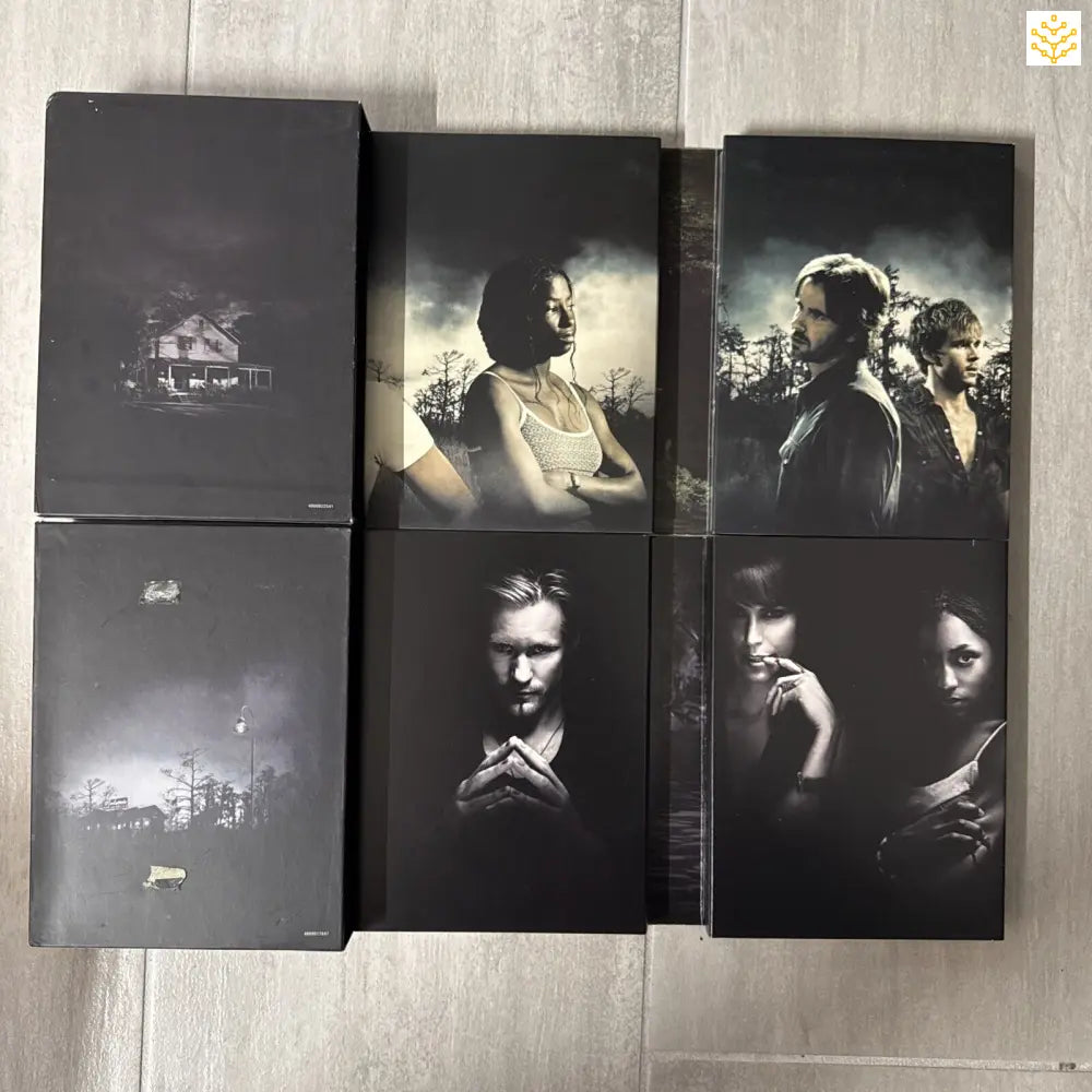 Collection of dark-themed DVD or Blu-ray box sets arranged in a grid pattern.