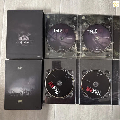 DVD box set of the TV series True Blood with multiple discs displayed.