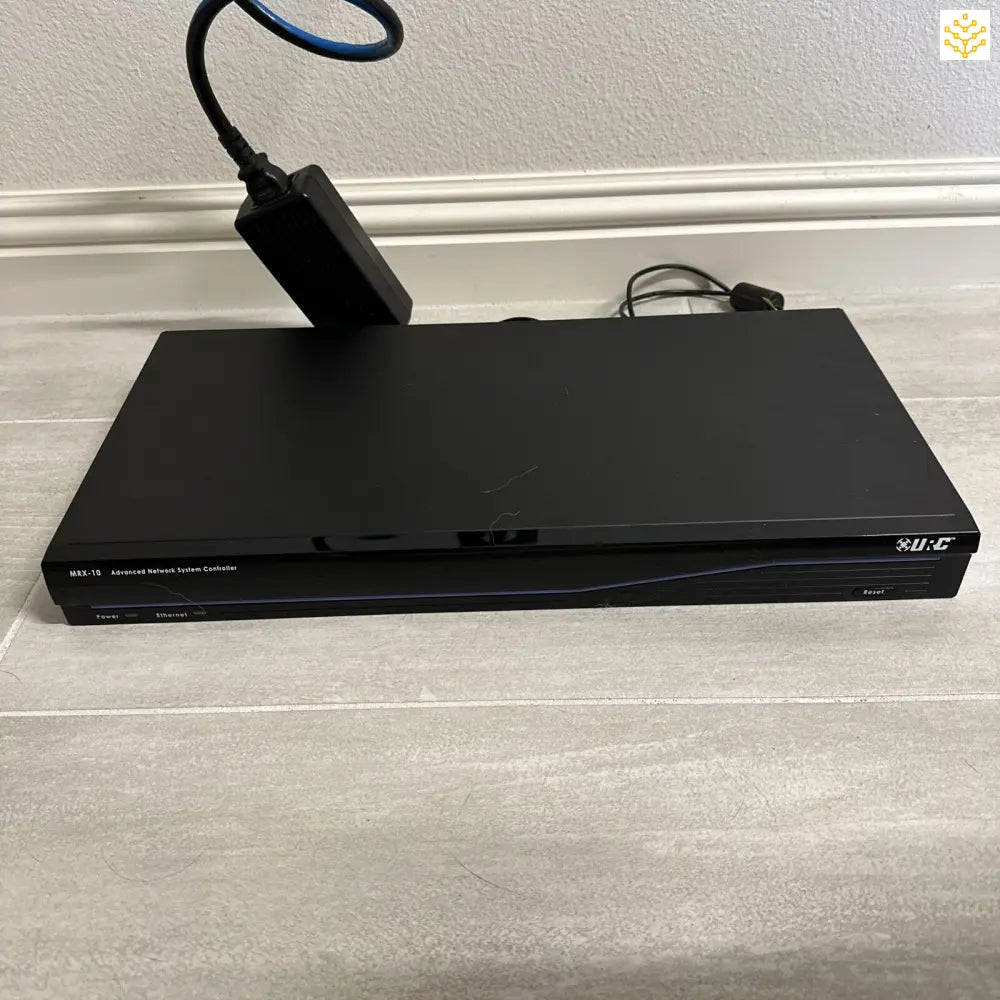 Black DVD or Blu-ray player with cables connected.