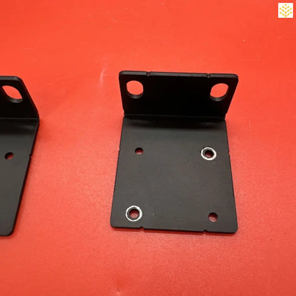 Black metal mounting bracket with holes and eyelets.