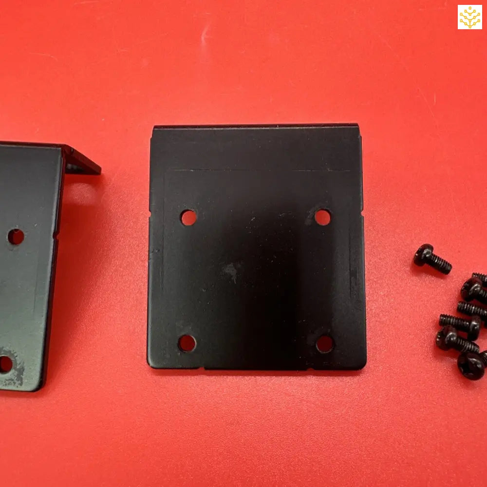 Black metal mounting bracket with four screw holes.