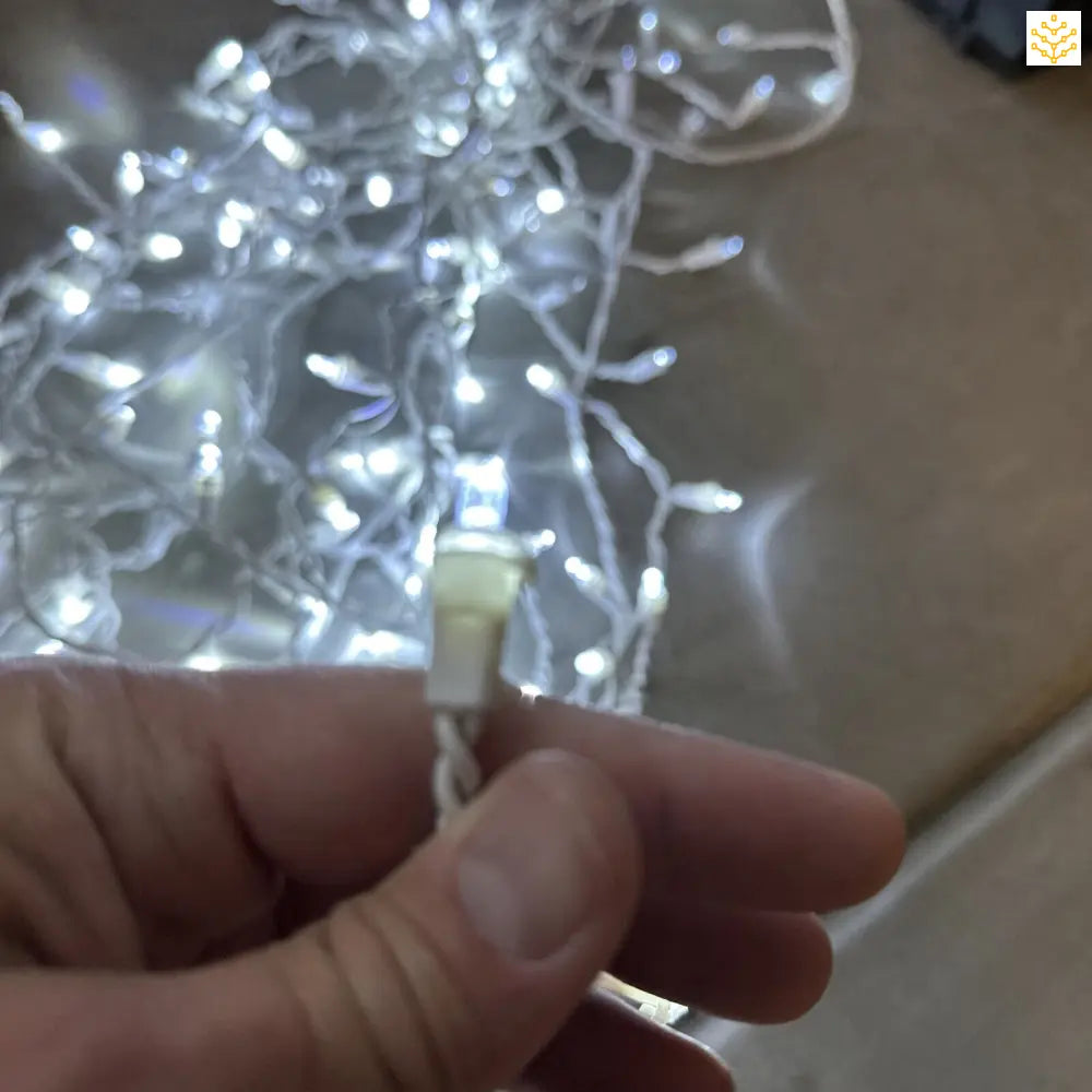 White string lights with a power connector.