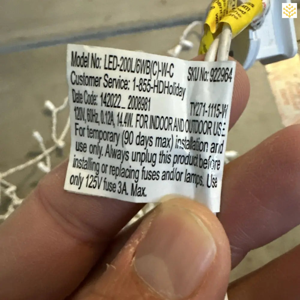 Product label showing model number and safety information for an LED light fixture.