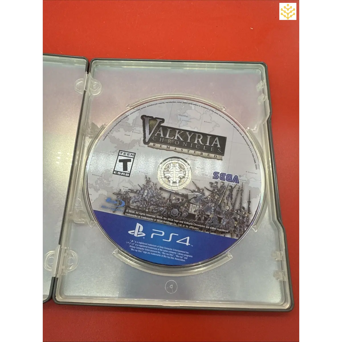 PlayStation 4 game disc for ’Valkyria Chronicles’ in an open case.